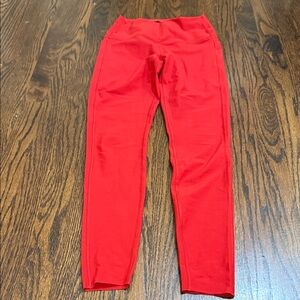 Peleton Cadent high rise pocket leggings in fiesta red.  Women’s size small